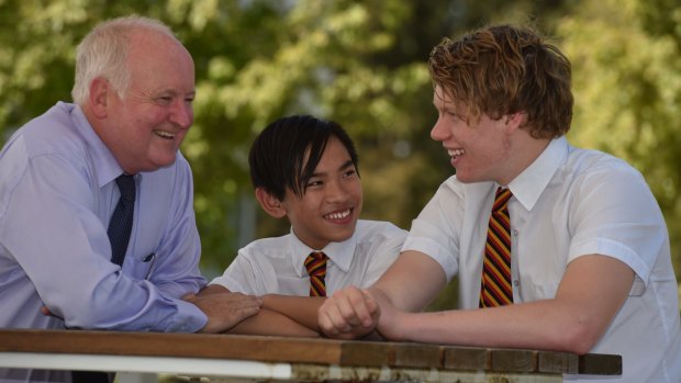 Inclusive: Yarra Valley's hearing unit has been operating in conjunction with the broader school for 40 years. Ian Saynor, left, with students Nelson Vu and Sam McLarty, has been at the school for 21 years.