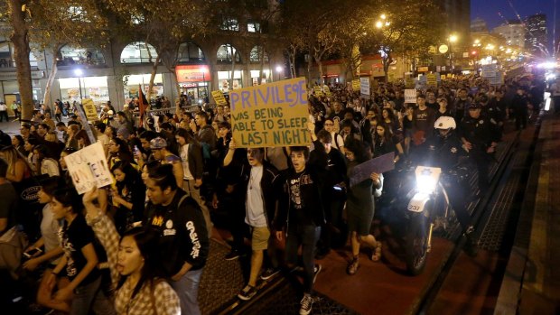 Protesters march in opposition to Donald Trump's presidential election victory in San Francisco.