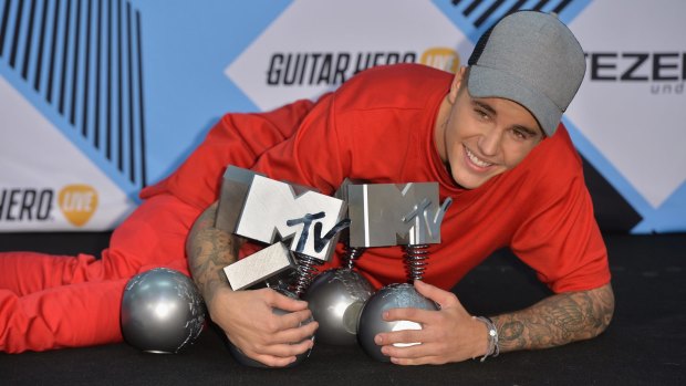 Haul: Justin Bieber poses after winning multiple awards at the MTV EMAs in Milan.