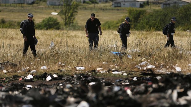 Australian Federal Police and their Dutch counterparts at the MH17 crash site outside the village of Grabovka.