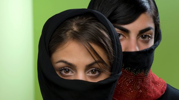 Many women wear the black chador in Iran, which leaves only the face and hands visible, but you could design a fashion spread around the accessories and variations.