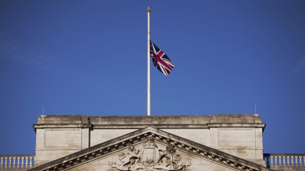 A Union flag flies at half-mast on Buckingham Palace in London, to mark an official day of mourning a week since the deadly Tunisia beach attack.
