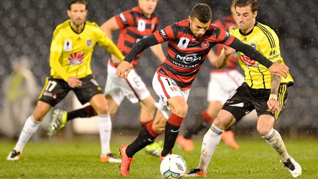 Jaushua Sotirio of the Wanderers gets on the front foot against Phoenix.