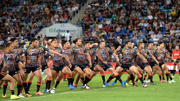 Star-studded: Greg Inglis leads the Indigenous war dance before a reasonable crowd prior to the All stars clash on the Gold Coast.