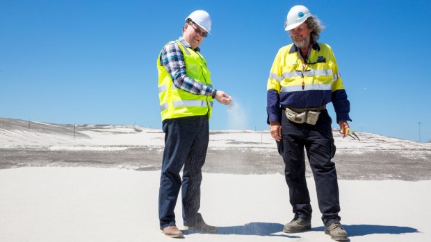 Brisbane's New Parallel Runway project director Paul Coughlan (left) with works inspector Des Hasemann on top of 11 million cubic metres of sand that is ready to become Brisbane's new runway.