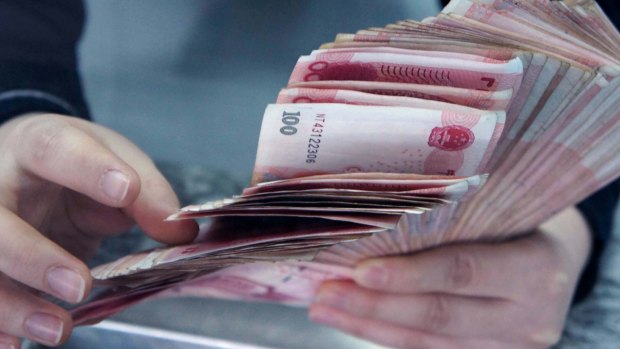 The People's Bank of China set the yuan's daily fixing, which limits onshore moves to 2 per cent on either side, at 6.7008.