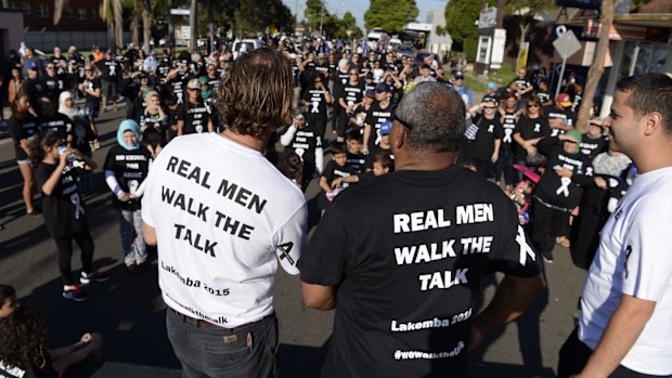 People gather for a White Ribbon Day March in Lakemba in 2015. The day is  just a small part of what is needed to address the multi-layered issue of family violence.