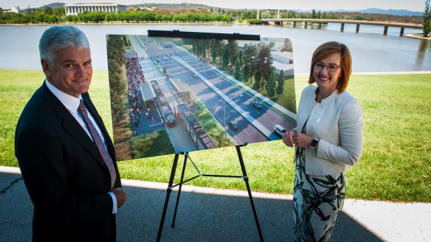 Minister for Transport Meegan Fitzharris, right, and light rail project director Scott Lyall open tenders for the Woden light rail line, which will travel across Commonwealth Avenue bridge.