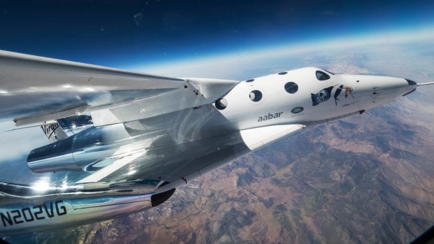 Virgin Galactic’s spaceship VSS Unity glides over California’s Mojave desert during its first flight last year.