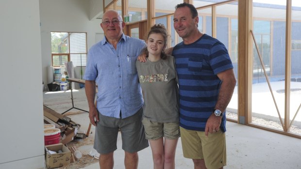 Ricky Stuart, with Emma and foundation director John Mackay, left. His dream for a respite home was made possible through the generosity of sponsors, project managers and architects. 