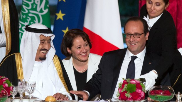 Uneasy alliance: Saudi Crown Prince Salman bin Abdulaziz al-Saud laughs with French President Francois Hollande at an official dinner in Paris on September 1.