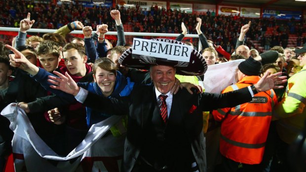 Bournemouth chairman Jeff Mostyn and fans celebrate victory.