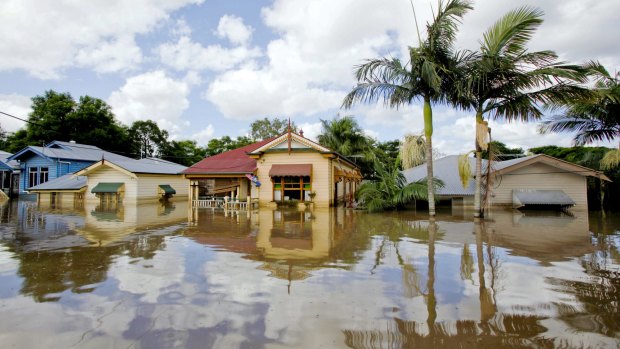 Weather events, such as the 2011 floods in Brisbane, pictured, have not had a large impact on bank losses. But a new report argues these risks will increase over time.