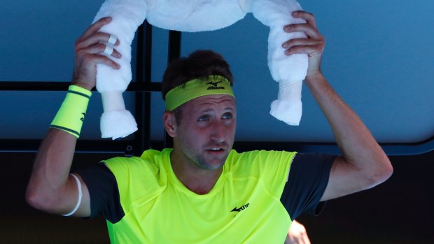 Feeling the heat: Tennys Sandgren during his loss to Hyeon Chung.