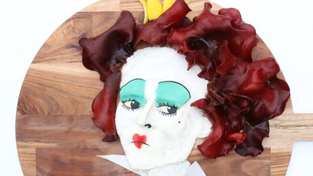 A portrait of Helena Bonham Carter as Alice in Wonderland's Red Queen captures the character's haughty disposition in red cabbage, fungi and cream cheese.