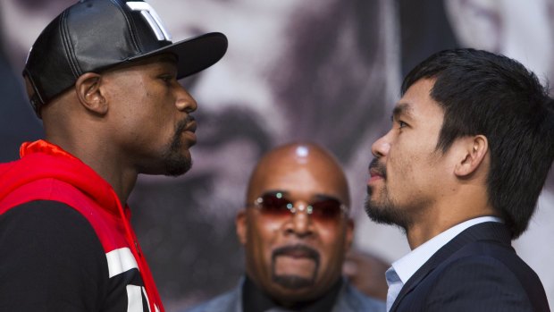 Let's get ready to rumble: Floyd Mayweather jnr (left) and Manny Pacquiao prepare for battle.