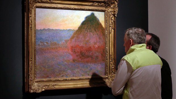 Claude Monet's "Meule" is displayed at Christie's, in New York, on Friday, November 4.