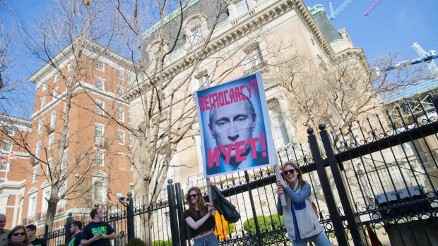 Demonstrators in front of the Russian Ambassador's Residence in Washington during a 'Not My President's Day' rally on February 20.