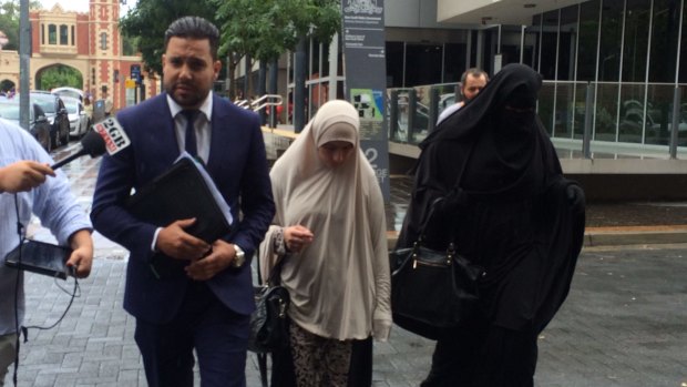 Sameh Bayda's lawyer Fadi Abbas with two women, who sat in court to support Sameh Bayda, outside Parramatta Bail Court