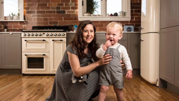 Owner of nanny agency GLK Nannies, Georgie King, 26, and her client, 15-month-old Harry.