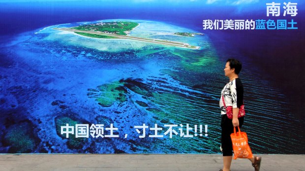 A billboard reads "South China Sea, our beautiful motherland, we won't let go an inch" in China's Shandong province.