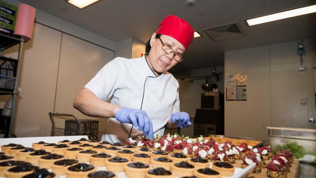 Chef Christine Hearn preparing canapes for a function at the National Portrait Gallery.