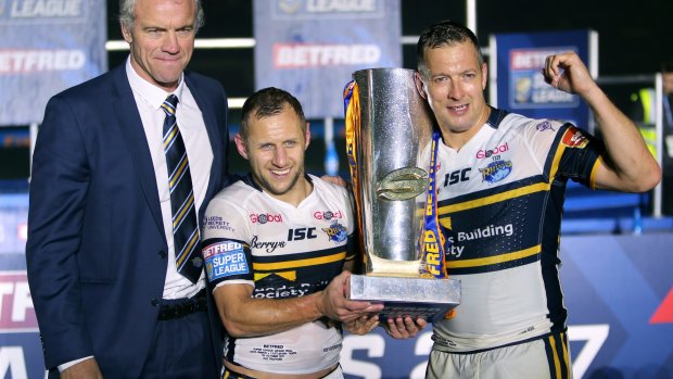 Leeds Rhinos coach Brian McDermott , Rob Burrow and Danny McGuire celebrate with the trophy after the final whistle during the Betfred Super League Grand Final at Old Trafford.