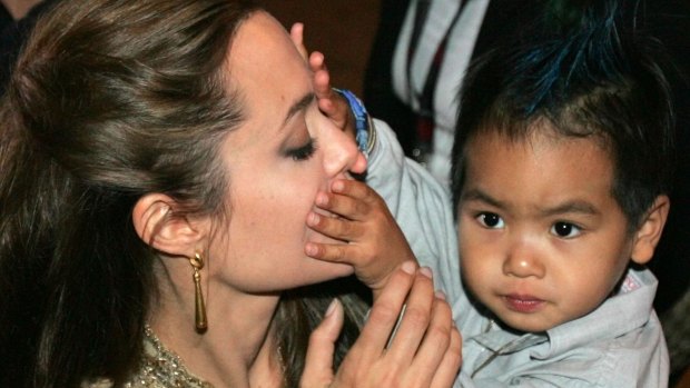 Angelina Jolie with Maddox in 2004. She says he is her son but he also belongs to Cambodia.