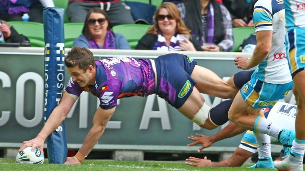 Matt Duffie of the Melbourne Storm scores a try which was later disallowed by the video referee during the round 22 match against the Gold Coast Titans.