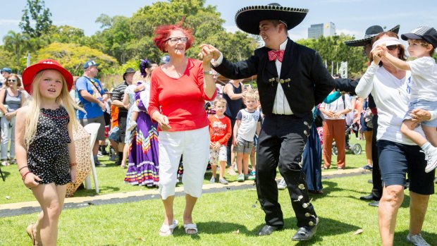 Dancers get involved with the crowd at the Brisbane Mexican Festival.