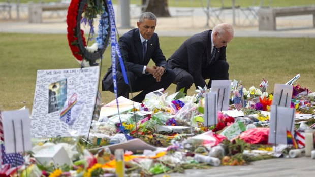 President Barack Obama and Vice President Joe Biden visit a makeshift memorial in Orlando.