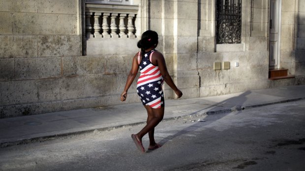 A woman wearing a dress inspired by the US flag in Havana on Sunday.