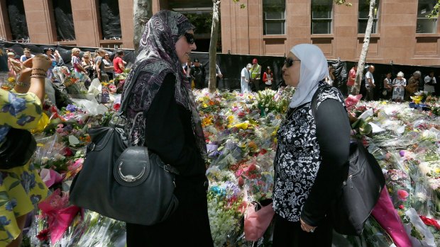 Latife Bahsoun of Roselands with a friend at Martin Place to pay tribute to the victims of the Lindt Cafe siege.