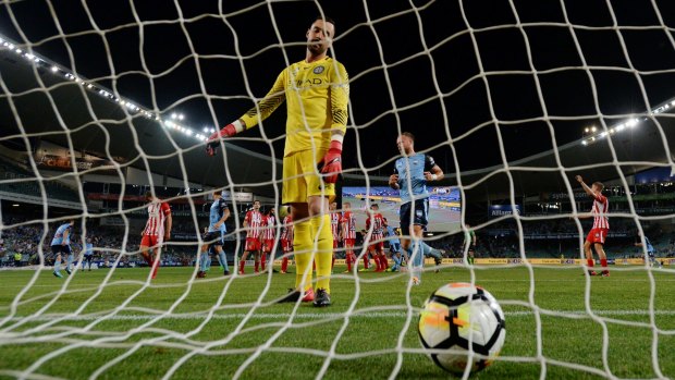 Back of the net: Melbourne City goalkeeper Dean Bouzanis retrieves the ball after Adrian Mierzejewski's cracking free kick.