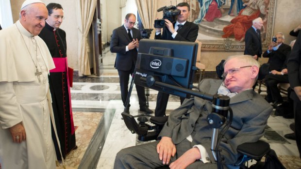 Pope Francis greets physicist Stephen Hawking during an audience with participants at a plenary session of the Pontifical Academy of Sciences, at the Vatican on Monday.