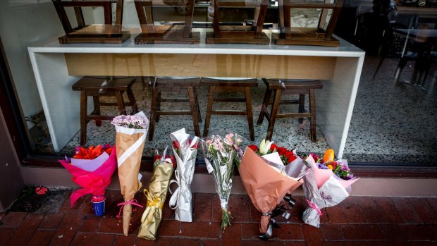 Tributes for Joseph Acquaro in front of his Brunswick East cafe on Wednesday.