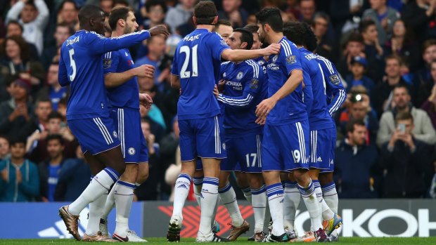 Unfamiliar feeling: Chelsea players celebrate after the team's second goal against Sunderland.