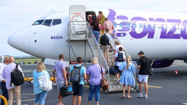Passengers board the first Bonza flight on the Sunshine Coast on Tuesday morning.