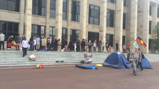 Protesters setting up tents outside Parliament House. 