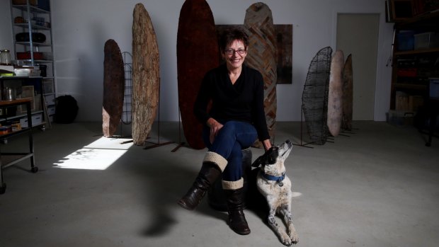 Artist and author Kim Mahood with her dog Pirate in her studio near Canberra.