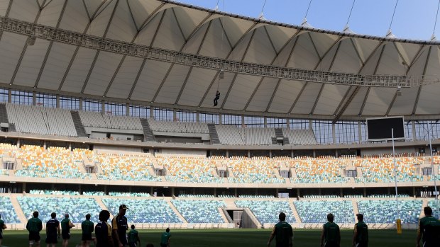 A bungee jumper interrupts a training session at Moses Mabhida Stadium.