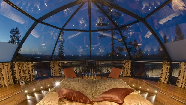 Guestroom in a glass igloo at Kakslauttanen Arctic Resort in Finland.