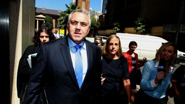 Treasurer Joe Hockey leaves court during the defamation case against Fairfax Media.