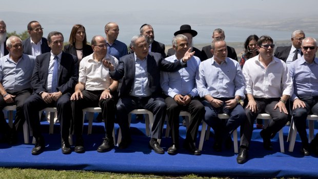 Mr Netanyahu with his ministers on the occupied Golan Heights. 
