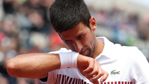 Thiem's the breaks: Novak Djokovic feels the strain during his loss to Dominic Thiem.