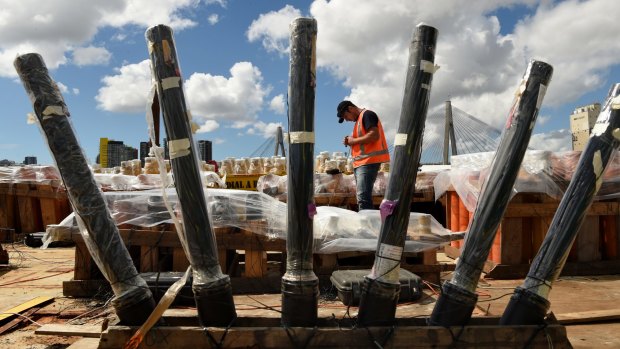 Francesco Caratozzolo of Foti Fireworks inspects fireworks at White Bay in preparation for Thursday's New Year's Eve celebrations.