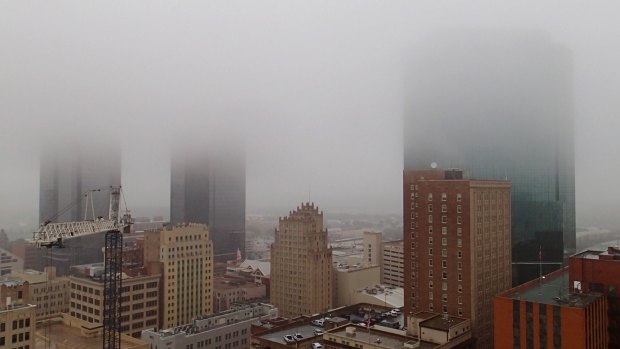 Downtown Fort Worth, Texas, is shrouded in low clouds on Friday.  