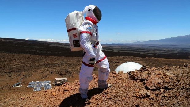 A scientist walks outside in a 2013 'Mars' mission at Mauna Loa, which went for four months.