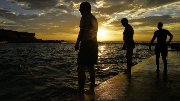 Swimmers take to the water at Clovelly Beach before the temperatures rise in Sydney.