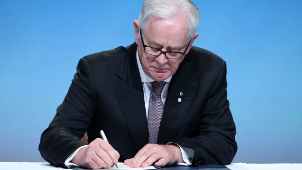Australia's Minister of Trade and Investment Andrew Robb signs the Trans Pacific Partnership in Auckland, New Zealand, last week.